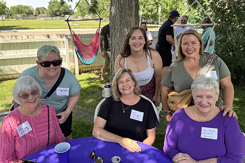 Gathering of people at a regional alumni event